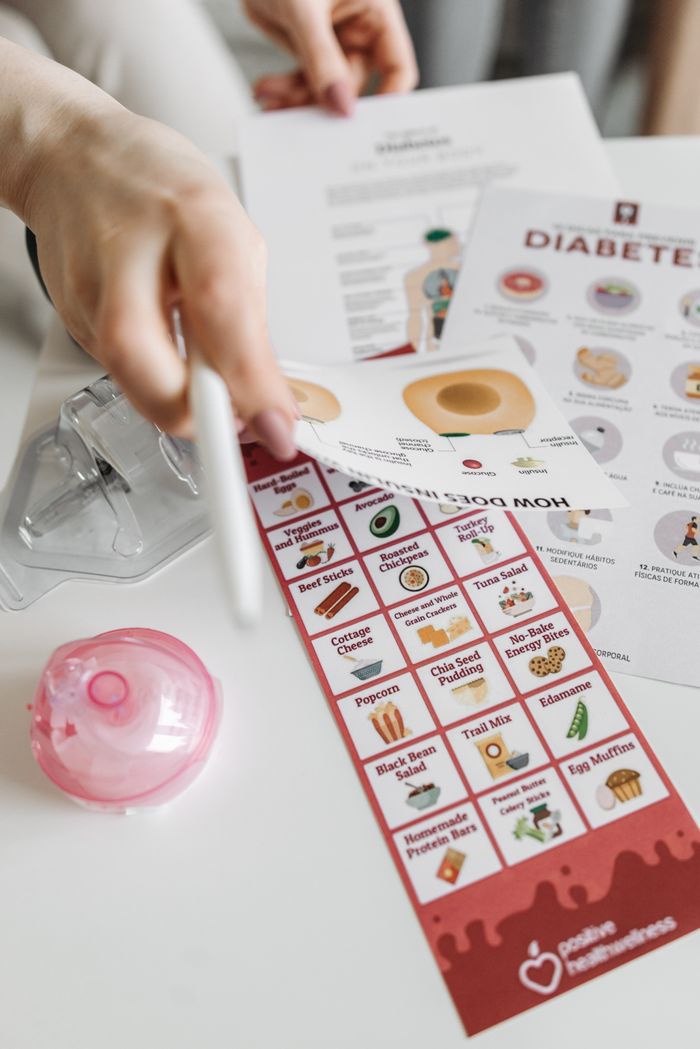 about-01 Informative diabetes pamphlets and dietary guide with hand interaction.